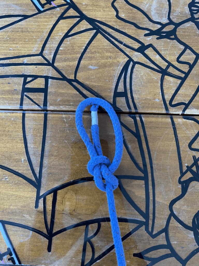 A tied bowline knot on a table